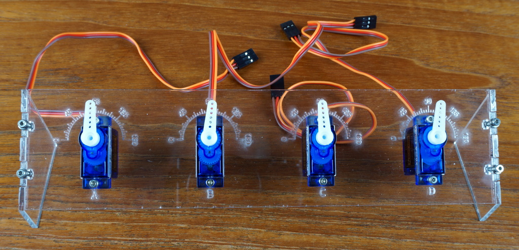 Four servos mounted in the servo test stand